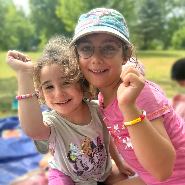 Two girls with friendship bracelets at Camp Gedi